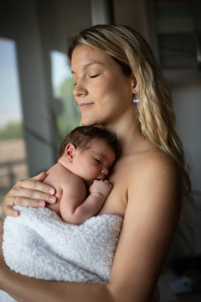istock Newborn baby in mother's arms 1433367299