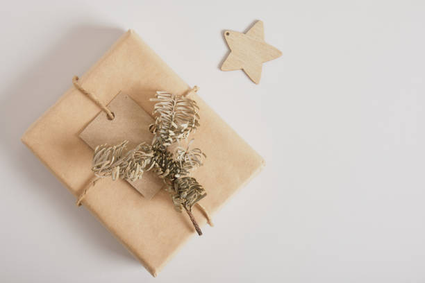 istock gift boxes with kraft paper on gray background, original gift decor with minimalistic eco-friendly christmas decor 1433367462