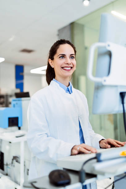 istock Smiling woman in a laboratory for medicine analyzing data 1433368114