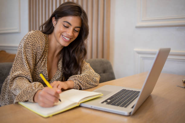 istock Young fashionable woman working at home 1433371114