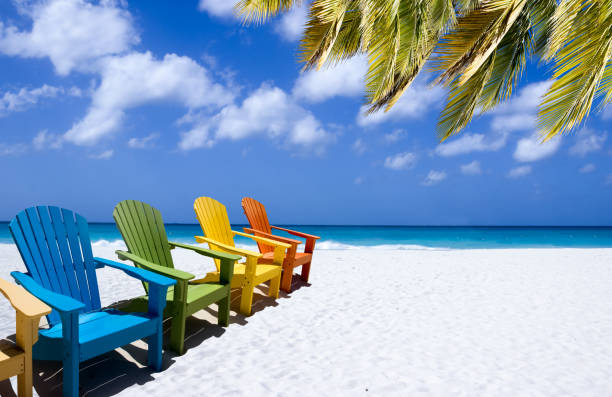 istock Colorful wooden chairs on white sand beach 1433374558