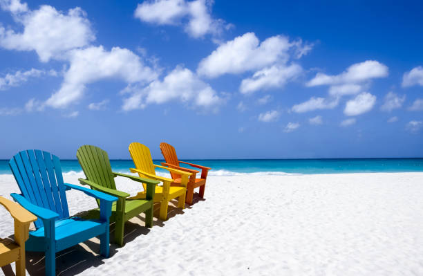 istock Colorful wooden chairs on white sand beach 1433374573
