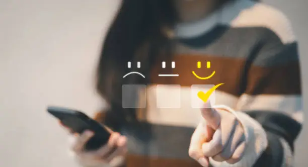 Photo of Customer service evaluation concept. woman client pressing smiley face emoticon on virtual touch screen. best rating positive, quality review, feedback survey, marketing performance, satisfaction user