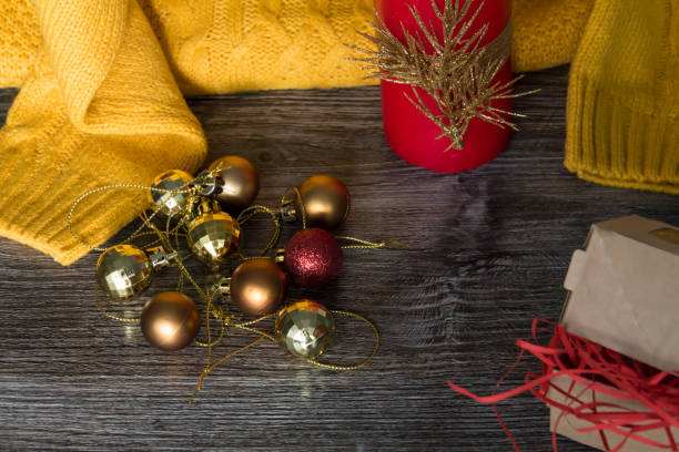 istock New Year decorations and decorations with a yellow sweater and a red candle. 1433375987