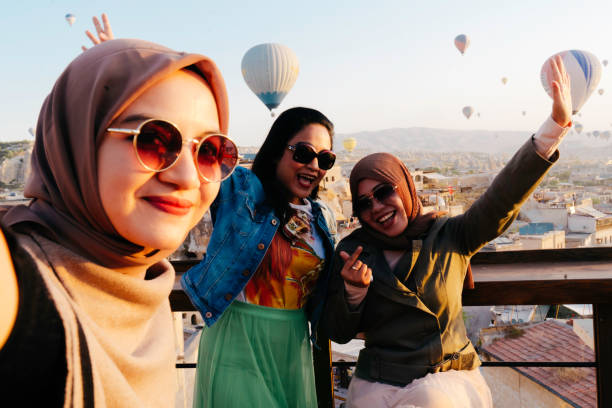 istock female friendship taking selfie photo using smartphone 1433376196
