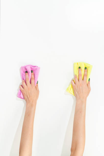 istock woman hand holding cleaning cloth on white background 1433376888