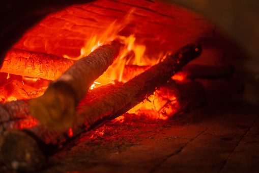 Wood burning oven for baking pizzas, breads and calzones.
