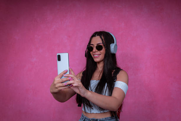 istock Cheerful modern woman taking a selfie 1433381813