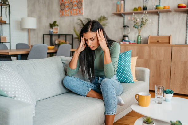 istock Young Woman Having A Headache At Home 1433385713
