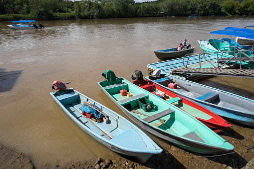 Puntarenas, Costa Rica - September 09, 2022: Boats with outboard motors on the banks of the Sierpe River