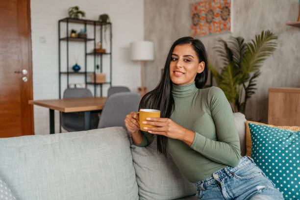 istock Young Woman Drinking Coffee At Home 1433386006