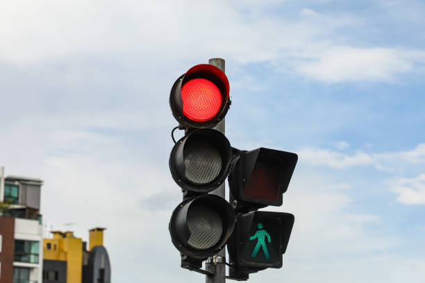 istock Vehicle traffic light in red, next to pedestrian which is green 1433387396