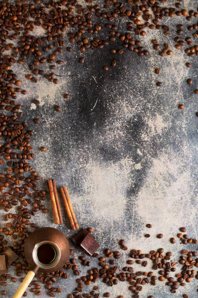 istock freshly brewed Turkish coffee and strong roasted coffee beans on an old background, chocolate and cinnamon as serving elements 1433387401