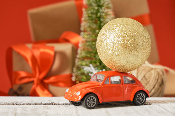 istock miniature red retro car model, christmas background 1433389241