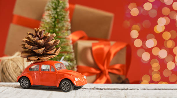 istock miniature red retro car model, christmas background 1433389243