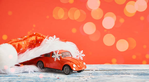 istock miniature red retro car model, christmas background 1433389249