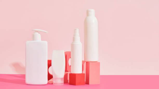 istock several different white plastic bottles and tube on pink geometric podiums on pink background 1433389776