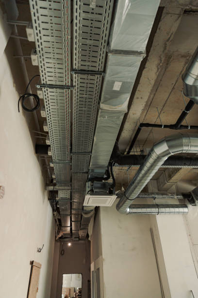 istock HVAC building interior air duct, Air Condition pipe line system on the ceiling.  Industrial background 1433390122