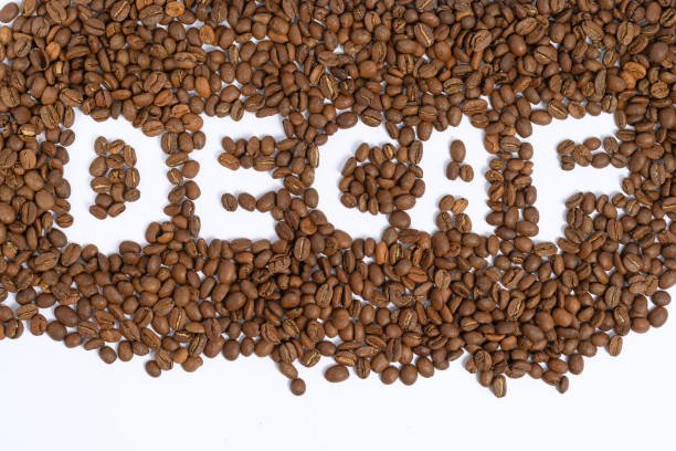 the inscription between the coffee beans is caffeine-free coffee. - caffeine free imagens e fotografias de stock