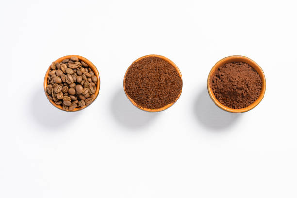 istock Three cups of coffee beans, ground coffee and cocoa for comparison. 1433393912