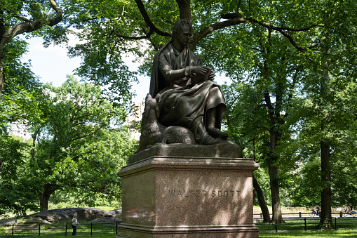 New York, NY, USA - June 10, 2022: The statue of Walter Scott by John Steell (1871) in Central Park.