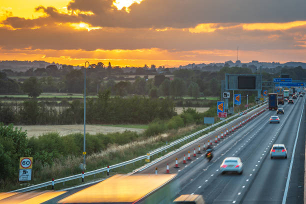 istock heavy traffic in blurry motion on UK motorway in England 1433398251