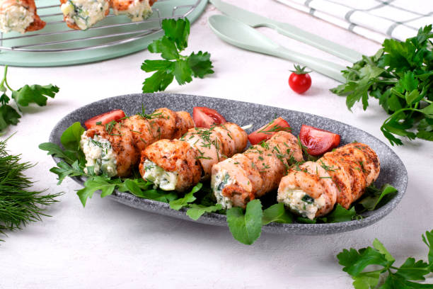 Chicken rolls stuffed with lettuce, egg, cheese, cucumber and sour cream