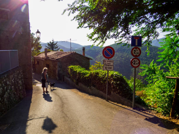 Woman enjoys staycation in Italy, doing photography in Tuscany, taking photos of the beautiful scenics and landscapes with her analog film rangefinder camera.