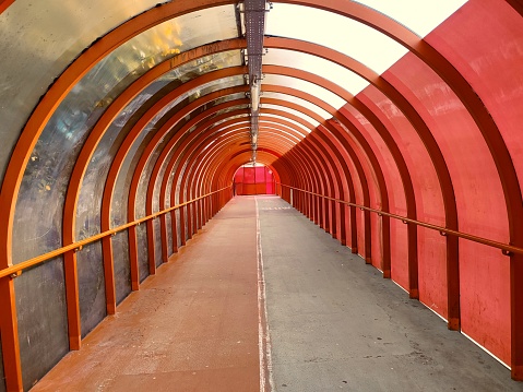 Covered pedesterian walkway bridge over the Highway at glasgow scotland england uk