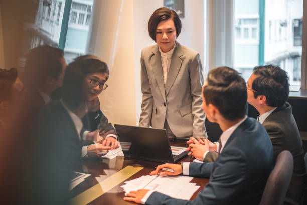 istock White Collar Professionals Working In A Bank 1433403684