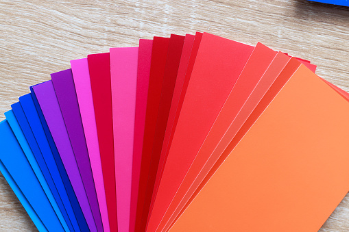 Paint Color Sample Gradient Rainbow. Color Options for Home Office. Paint Swatches on Wood Desk\nShot on Canon R5