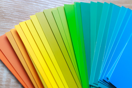 Paint Color Sample Gradient Rainbow. Color Options for Home Office. Paint Swatches on Wood Desk\nShot on Canon R5