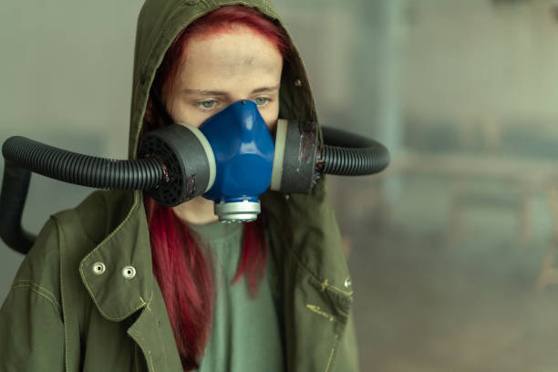 istock Post apocalypse female survivor in oxygen mask. 1433405271