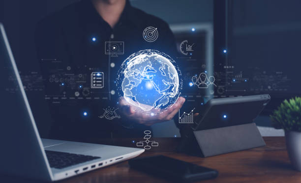 istock Hand of Businessman hold virtual global with hologram using metaverse and internet connection. Business technology link digital marketing. Big data and Financial banking. 1433411052