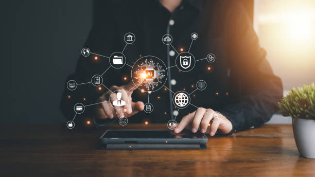 istock AI (Artificial intelligence) concept. Businessman hand touch tablet with hologram technology. Business technology link digital marketing. Big data and Financial banking. 1433411097