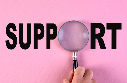 Support  Type On Pink Background.