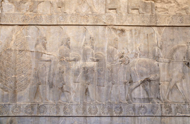 istock Ancient wall with bas-relief with assyrian foreign ambassadors with gifts and donations, Persepolis, Iran 1433418852
