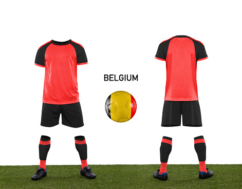 Uniform and ball with the flag of the BELGIUM national team participating in Qatar 2022 with a grass floor on a white background.