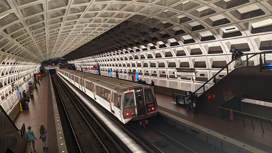A train pulls into the McPherson Square Metro station, on the blue, orange, and silvere lines, in Washington, DC.