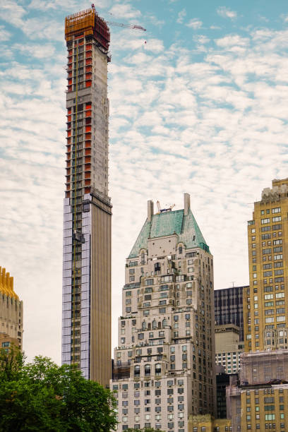 Modern construction site of a tall skyscraper, crane, Central Park - Manhattan , New York