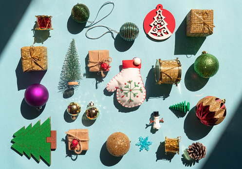 Christmas related objects and ornaments on blue background