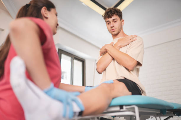 istock Female physiotherapist is examining to her patient. 1433429269
