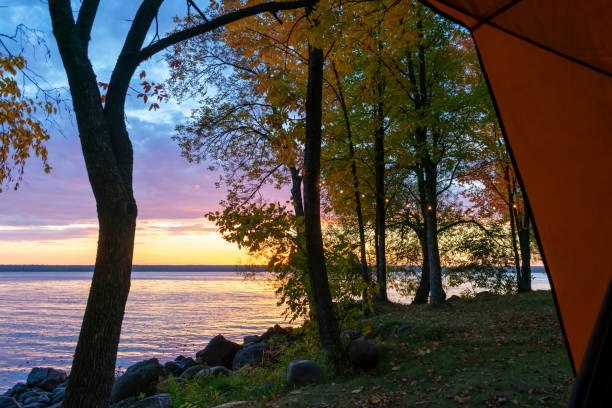 istock Sunrise lake view from a tent 1433429821