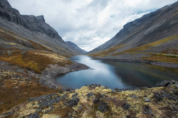 istock Blue northern lake in harsh mountains in north 1433433689