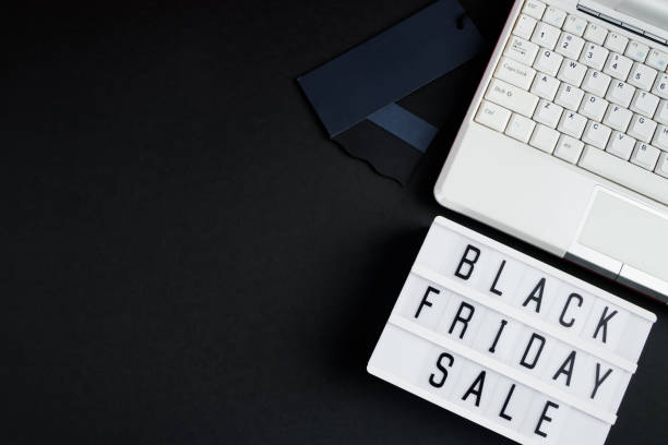 istock Black Friday sale concept. Laptop and lightbox on dark background. 1433438091