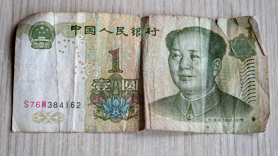 1 Chinese yuan banknote background, Old worn with large background texture, top view.