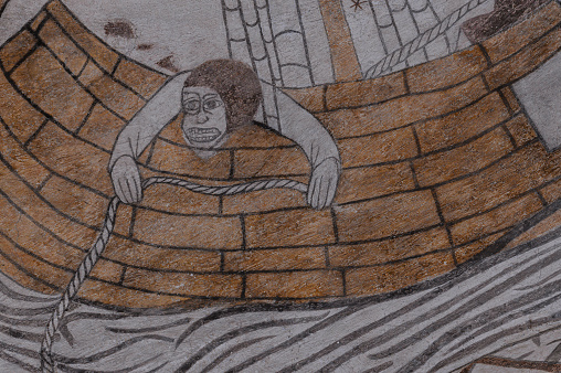 seasick sailor haning out over the gunwale, an old fresco from the 1500s in Kirke Hyllinge church, Unknown artist about 1500, free of copyright protection, Denmark, October 4, 2022