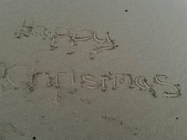 istock Happy Christmas wrote in the sand 1433446320