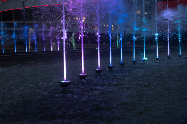 istock Multi-colored city fountain in the dark on a summer evening. 1433447099