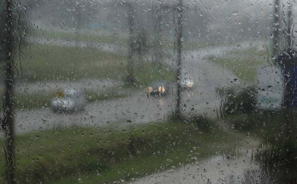 istock ainwater drops on glass - street rain 1433448187
